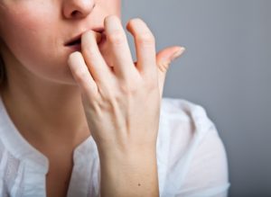 Depressed, sad woman on neutral background