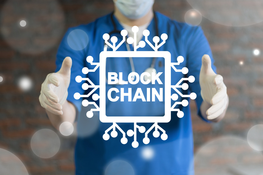 Blockchain Medicine Information Technology. Doctor using virtual interface offers semiconductor (circuit board) blockchain text icon. Block Chain Health Care concept.