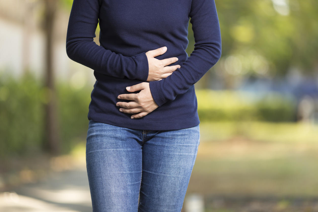 Woman Has Stomach Ache at Park