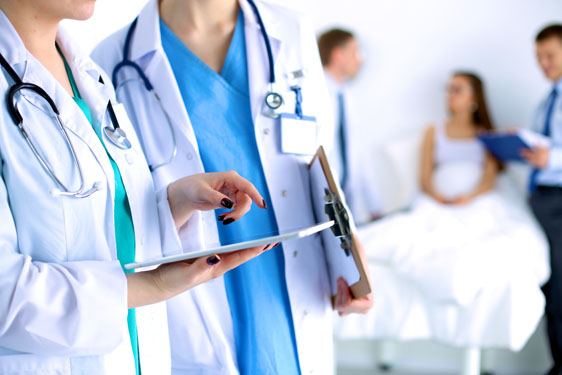 Young woman  doctor holding a tablet pc